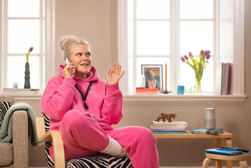 A Síminn customer on the phone at home